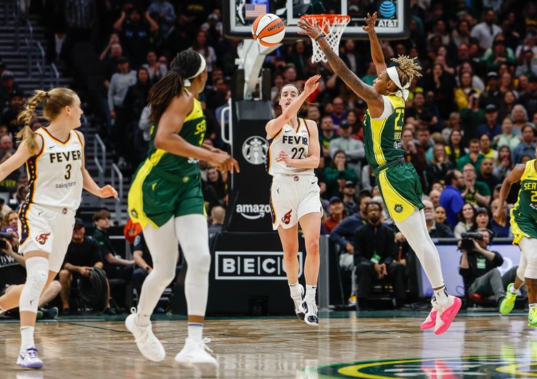 Indiana&#8217;s Caitlan Clark pushes the ball up the floor as the Fever close the gap with Seattle in the final minute of play.  The Indiana Fever played the Seattle Storm in WNBA basketball Wednesday, May 22, 2024 at Climate Pledge Arena, in Seattle, WA.  (Dean Rutz / The Seattle Times)