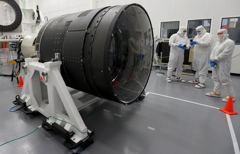 Staff members give media a tour of the newly-built 3,200 megapixel LSST camera, the largest camera ever built, at the SLAC National Accelerator Laboratory in Menlo Park, Calif., on Thursday, April 11, 2024. After two decades of work, the device will soon be packed up and transported to a mountaintop in Chile to help researchers better understand dark matter, dark energy and other mysteries of the universe. (Jane Tyska/Bay Area News Group/TNS)