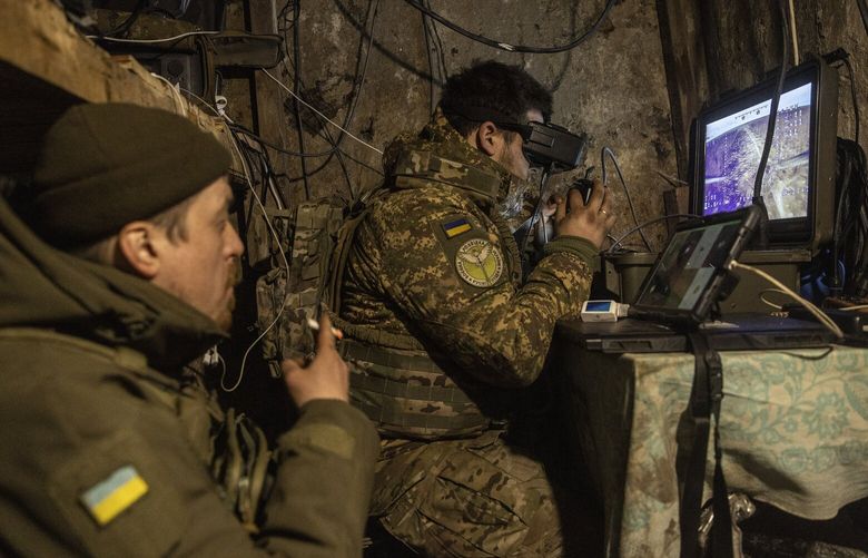 FILE — Wearing immersive goggles, a soldier who goes by the call sign DJ flies a First Person View drone from a front-line underground bunker in the Donetsk region of Ukraine, March 1, 2024. Ukrainian drone strikes target Russian nuclear radar stations; a radar facility more than 1,100 miles into Russia was damaged, satellite imagery showed. The attacks have drawn concern from U.S. officials. (David Guttenfelder/The New York Times) XNYT0189 XNYT0189