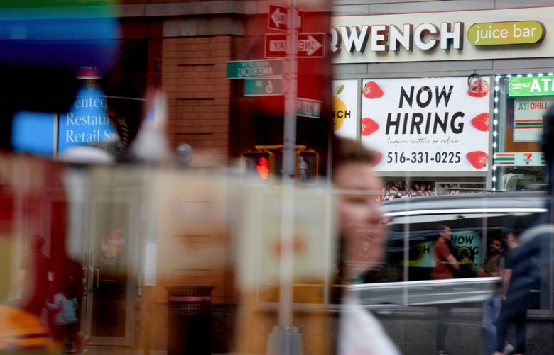 A “now hiring” sign outside Quench Juice Bar in New York, on April 29, 2024. The Federal Reserve spent much of 2022 and 2023 narrowly focusing on inflation as policymakers set interest rates: Prices were rising way too fast, so they became the central bank’s top priority. But now that inflation has cooled, officials are more clearly factoring the job market into their decisions again. (Gabby Jones/The New York Times)