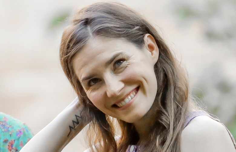 FILE – Amanda Knox attends a cocktail for the opening of the Innocence Project conference, in Modena, Italy, Thursday, June 13, 2019. Amanda Knox will be back in an Italian courtroom on Wednesday, June 5, 2024, to defend herself against a 16-year-old slander conviction that is the only charge against her that withstood five court rulings that ultimately cleared her in the brutal murder of her roommate, 21-year-old Meredith Kercher, in the apartment they shared in the idyllic central Italian university town of Perugia. (AP Photo/Antonio Calanni, File) XDS101 XDS101