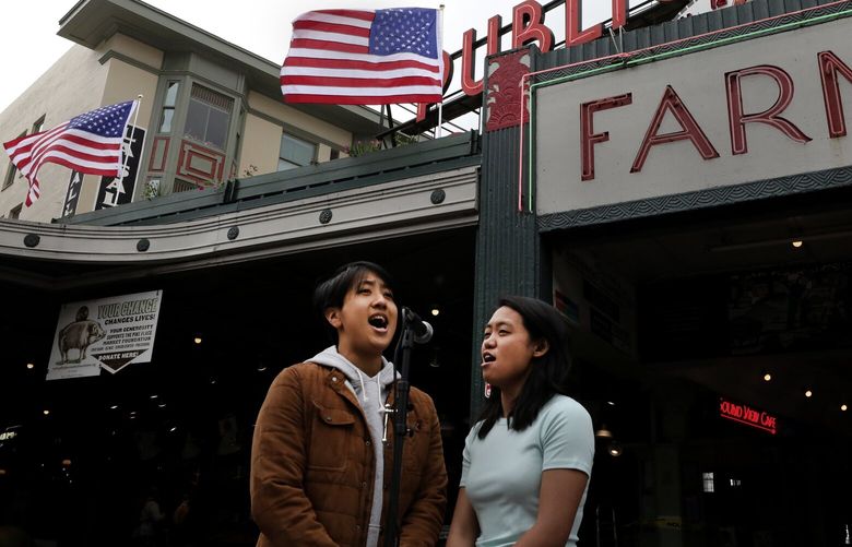 In recognition of Memorial Day and to honor military personnel, Pike Place Market buskers Jeannie Rak, left, and Carly Ann Calbero sing the National Anthem on Friday under the Public Market clock and sign.  The market also has placed flags.

Friday May 22, 2020

LO Linesonly 214037

Rakamnuaykit