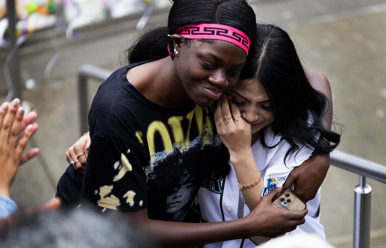 Garfield High School students hear supportive applause as they return, Tuesday morning, June 11, 2024 in Seattle. The school was closed Friday and Monday after the fatal shooting of student Amarr Murphy, 17.