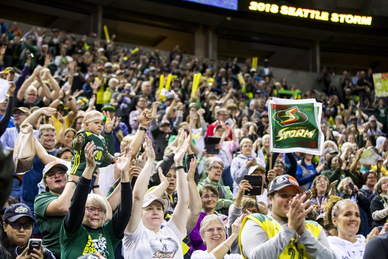 Fans cheer at a victory rally for the Seattle Storm, winners of the 2018 WNBA Championship, Sunday September 16, 2018 at KeyArena. (Bettina Hansen / The Seattle Times)