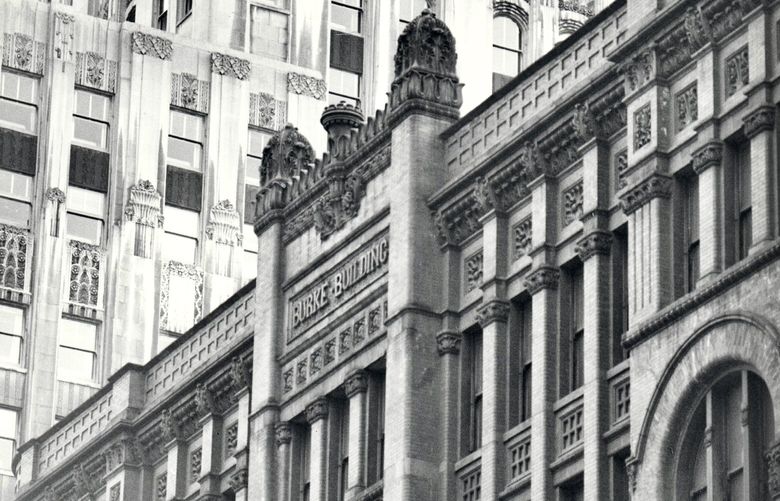 The Burke Building’s Second Avenue brick facade showcased terra-cotta panels, pilaster capitals, cornices and crown. The Art Deco Exchange Building forms a backdrop. (Mary Randlett, from &#8220;Made to Last: Historic Preservation in Seattle and King County&#8221;) 