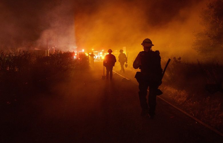 Firefighters work against the advancing Post Fire on Sunday, June 16, 2024, in Gorman, Calif. (AP Photo/Eric Thayer) CAET110 CAET110