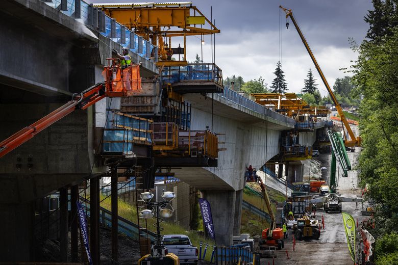 Work continues June 3 on the longest bridge in the Link light rail system during construction along wetlands near Federal Way that have made the engineering of the project a challenge. (Ken Lambert / The Seattle Times)