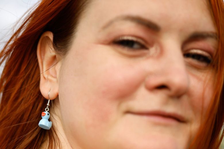 Tatyana Bondarenko sports a tiny blue duck earring during Duck Dodge. (Karen Ducey / The Seattle Times)