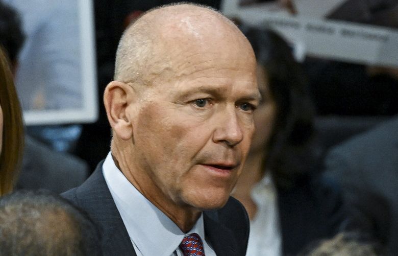 Dave Calhoun, the chief executive of Boeing, is confronted by families of plane crash victims before a Senate hearing on Capitol Hill, on June 18, 2024. The Justice Department is expected to allow Boeing to escape criminal prosecution for violating the terms of a 2021 settlement related to problems with the companyâ€™s 737 Max 8, according to people familiar with the discussions. (Kenny Holston/The New York Times) XNYT0494 XNYT0494