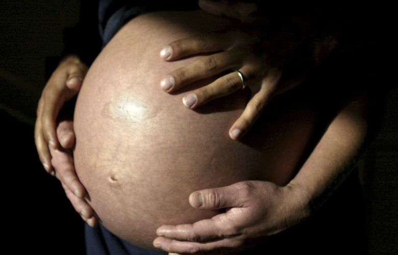 This Nov. 2005 file photo shows future parents awaiting the arrival of their first child in Carlsbad, Calif. When you’re expecting a baby, you hope nothing goes wrong. But at least one in 20 pregnant patients develops a scary complication called preeclampsia, a high blood pressure disorder that kills 70,000 women and 500,000 babies worldwide every year. New blood tests promise to help doctors predict and manage the condition. (AP Photo/Julie Busch, file) NYPS301 NYPS301