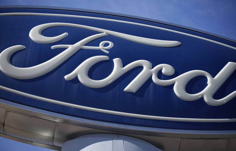  A Ford company logo on a sign at a Ford dealership in southeast Denver. (AP Photo/David Zalubowski, 2021) 