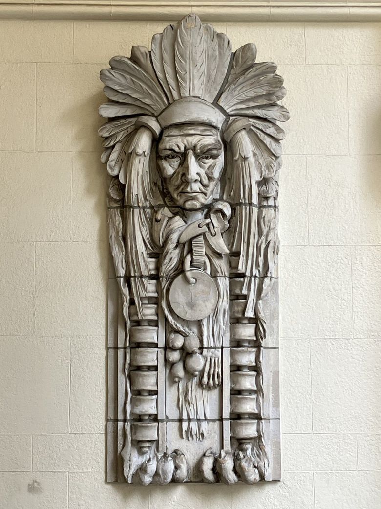 One of several salvaged terra-cotta sculptures is preserved in the vestibule entrance to the bank at the Cobb Building. You can clearly see the five separate clay molds required for each completed piece. (Lawrence Kreisman) 