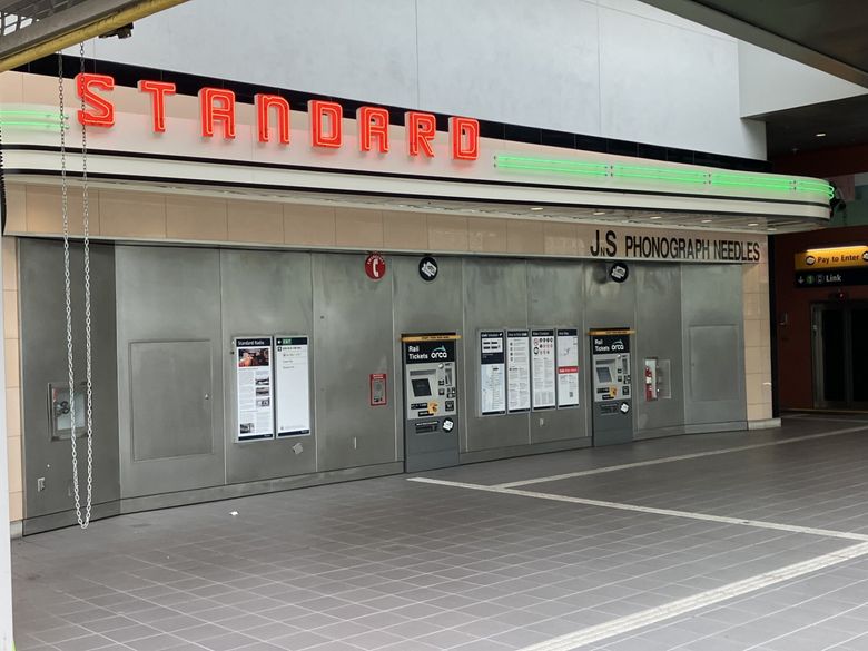 The restored neon sign and sections of the glass tile facade greet riders at the Roosevelt light rail station. (Lawrence Kreisman)