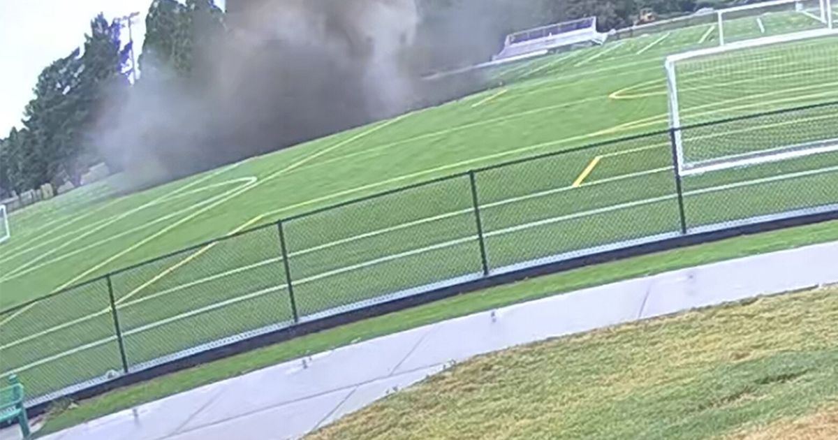 Giant sinkhole swallows the center of a soccer field built on top of a ...