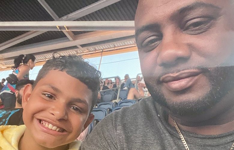 Charles Woods of Lakewood with his son, Charles at Lumen Field. Woods is the Pierce County coordinator for DADS, a nonprofit organization based in Seattle that offers parenting classes for fathers. Woods graduted from the classes and now works for the organization.