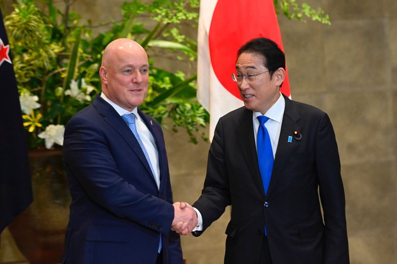 New Zealand Prime Minister Christopher Luxon, left, and Japan Prime Minister Fumio Kishida shake hands prior to their bilateral meeting at Kishida&#8217;s office in Tokyo Wednesday, June 19, 2024. (David Mareuil/Pool Photo via AP)