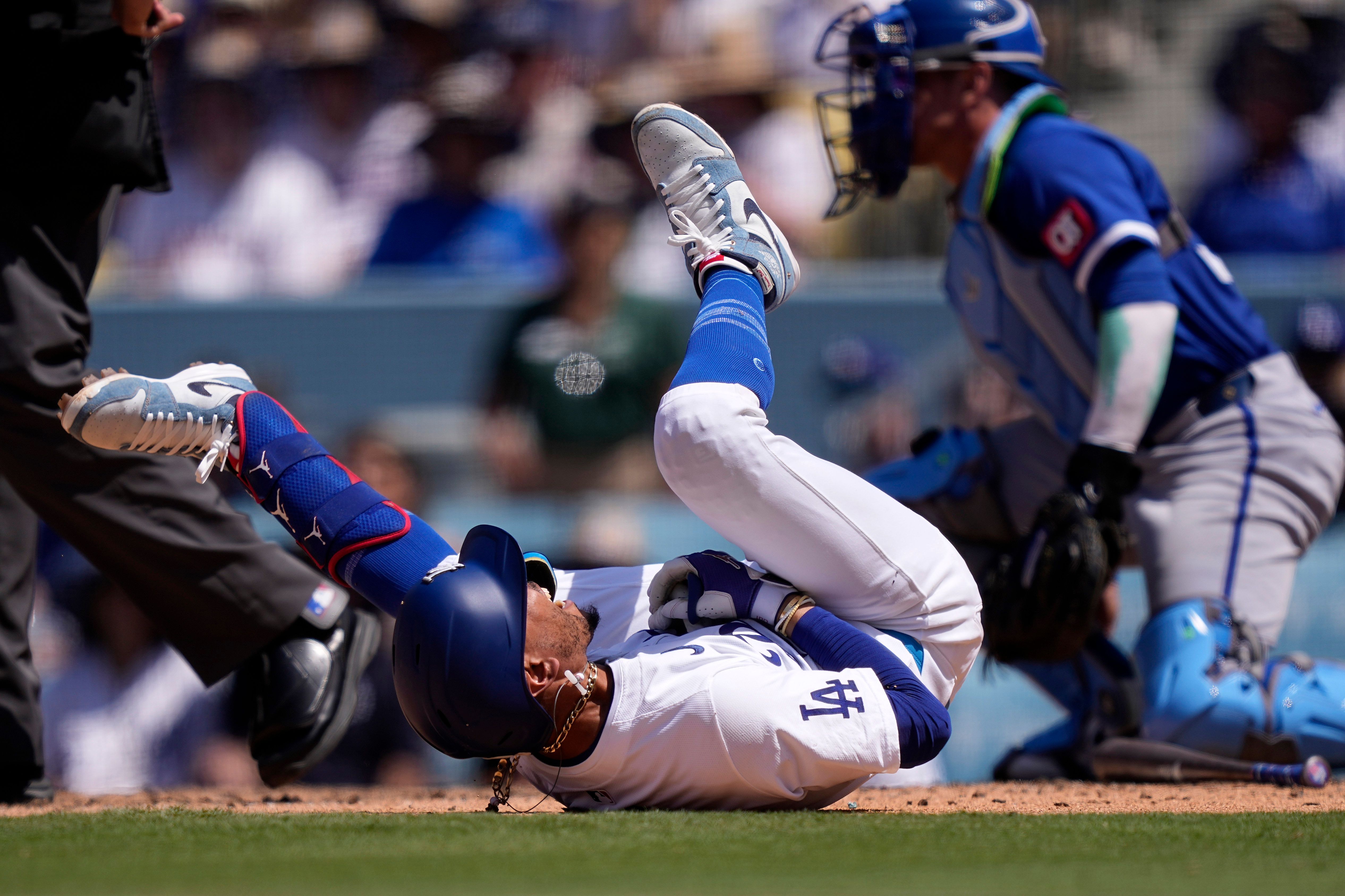 Dodgers star Mookie Betts suffers broken left hand when hit by a