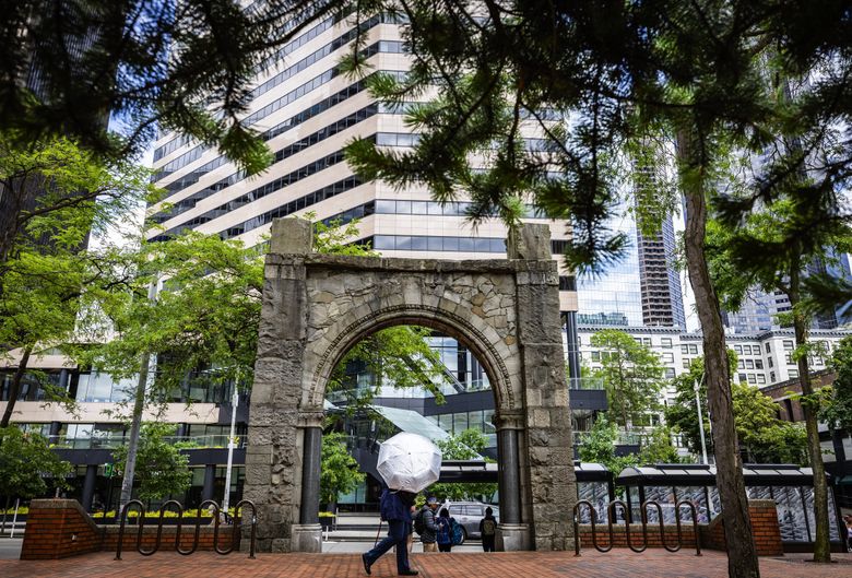 The stone arched entrance to the Burke Building at Second Avenue and Marion Street was salvaged and placed on the plaza of the Jackson Federal Building. (Ken Lambert / The Seattle Times)