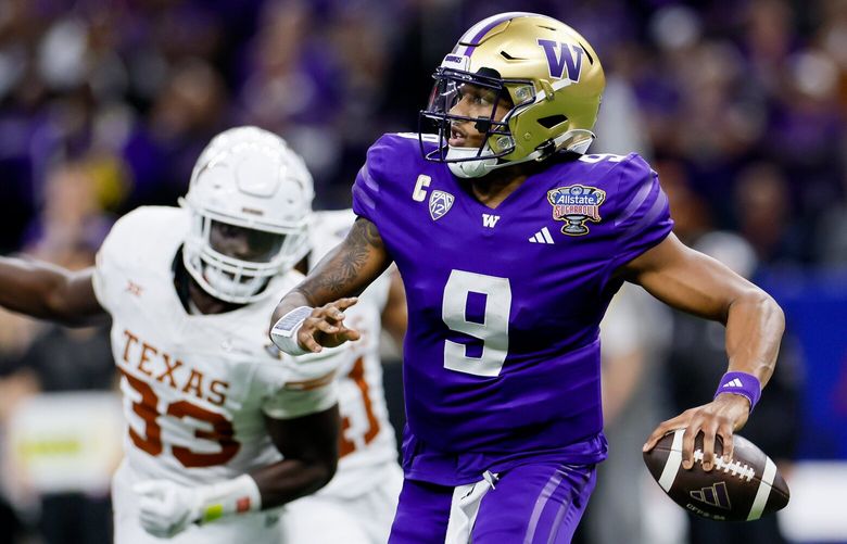 Washington Huskies quarterback Michael Penix Jr. winds up to pass during the fourth quarter of the Sugar Bowl Monday, Jan. 1, 2024 in New Orleans. 225854