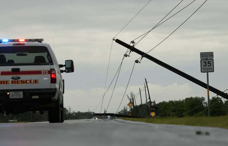 Power lines downed by the effects of Hurricane Beryl block a highway near Palacios, Texas, Monday, July 8, 2024. (AP Photo/Eric Gay) TXEG303 TXEG303
