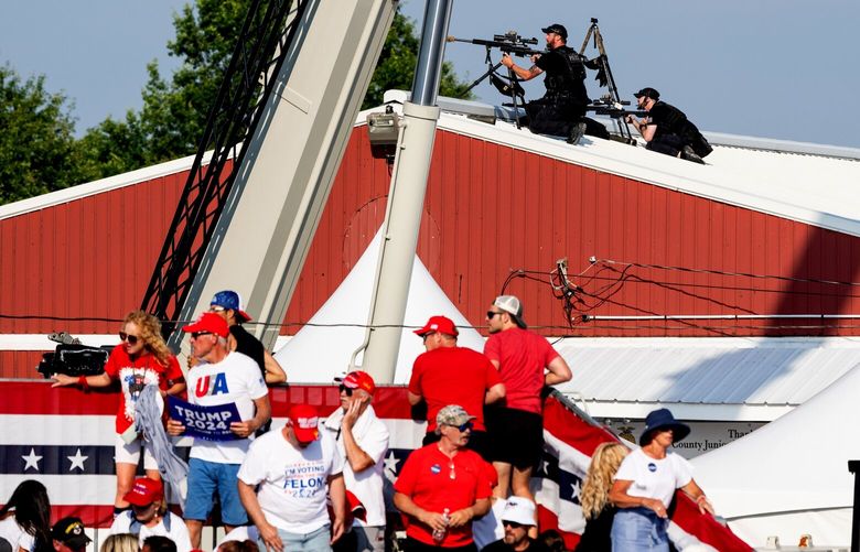Secret Service snipers and audience members react after shots are fired while former President Donald Trump speaks at a campaign rally in Butler, Pa., July, 13, 2024. The political violence – the first time in more than four decades that a man who was elected president of the U.S. was wounded in an assassination attempt – comes at an especially volatile moment in American History. (Eric Lee/The New York Times) XNYT0578 XNYT0578