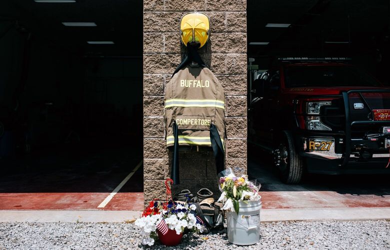 The gear of Corey Comperatore hangs outside the Buffalo Township Volunteer Fire Department in Sarver, Pa., on Tuesday, July 16, 2024. The funeral for Comperatore, the father of two and volunteer firefighter killed in the shooting at the Trump campaign rally in Butler, Pa., is scheduled to take place on Friday, July 19, 2024, at the church where he was a longtime member. (Kristian Thacker/The New York Times) XNYT0157 XNYT0157