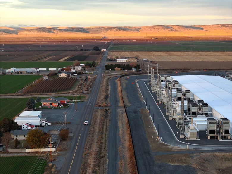 In Quincy,  it is not uncommon to find large data center warehouses, with several backup generators, surrounded by farmland and homes. (Karen Ducey / The Seattle Times)