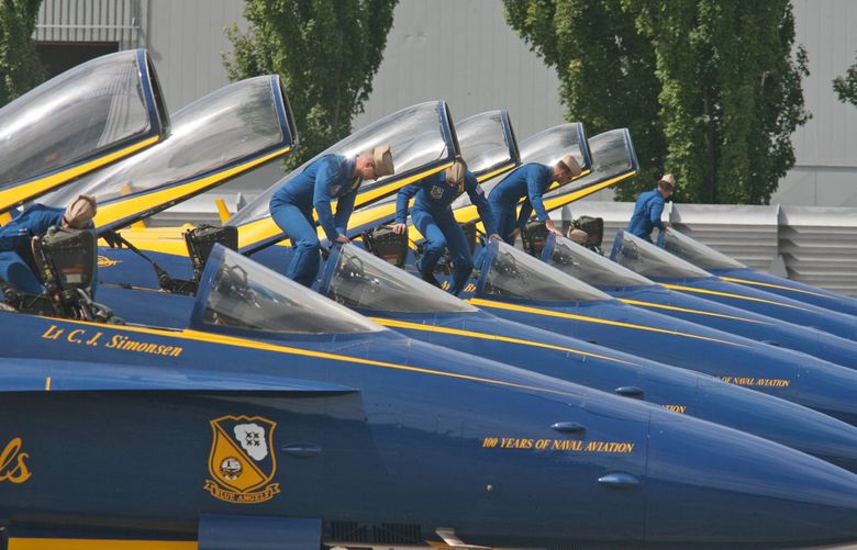 Blue Angels pilots exit thier aircraft after landing at Boeing Field just south of the Museum of Flight at Boeing Field in this 2011 file photo. (Greg Gilbert / The Seattle Times, 2011)