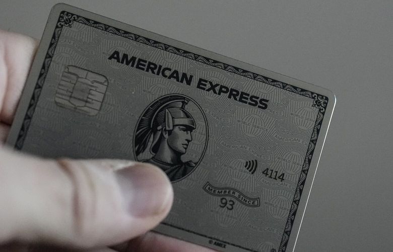 An American Express card is shown on Jan.18, 2024, in Atlanta. American Express reports earnings on Friday, July 19, 2024. (AP Photo/Mike Stewart, File) 