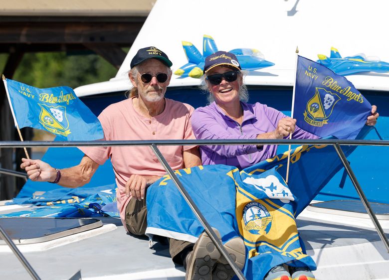 Seattle couple Terry Stipe, left, and Leslie Crow have lived on Lake Washington for decades. They&#8217;re massive fans of the Blue Angels. (Karen Ducey / The Seattle Times)