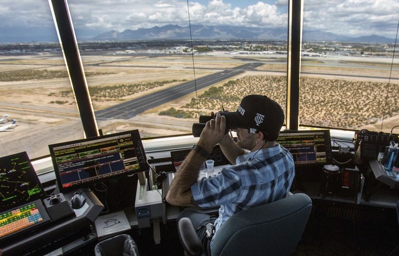 FILE – Air traffic controllers watch for traffic from the control tower at the Tucson International Airport, Friday, Sept. 23, 2016, in Tucson, Ariz. The Federal Aviation Administration said Wednesday, July 24, 2024, that it reached an agreement the union that allow air traffic controllers to get more rest between shifts. (Ron Medvescek/Arizona Daily Star via AP, File) AZTUS202 AZTUS202