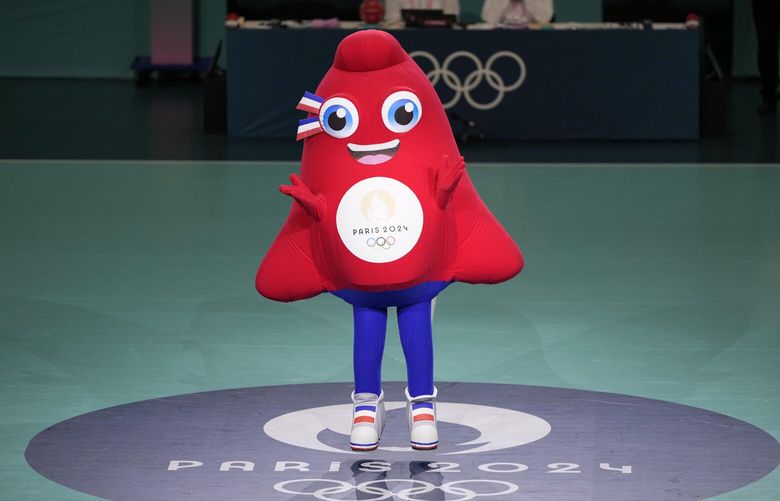 Phryge, the Olympics 2024 mascot dances at the South Paris Arena, during the men’s handball match between Denmark and Egypt at the 2024 Summer Olympics, Monday, July 29, 2024, in Paris, France. (AP Photo/Brian Inganga) OLYBI039 OLYBI039