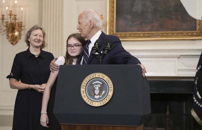 President Joe Biden hugs the 12-year-old daughter of Aslu Kurmasheva as he delivers remarks on a prisoner swap with Russia in the East Room at the White House in Washington, on Thursday, Aug. 1, 2024. A prisoner swap on Thursday involving seven countries freed the Wall Street Journal reporter Evan Gershkovich and two other Americans held in Russia, along with several jailed Russian opposition figures, the White House said, in the most far-reaching exchange between Russia and the West in decades. (Eric Lee/The New York Times) XNYT0412 XNYT0412