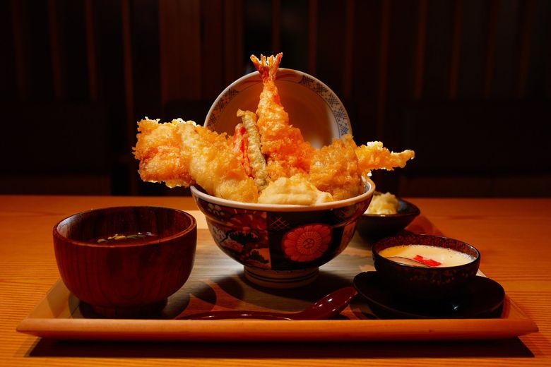 This is the premium tendon set at Tendon Kohaku, featuring eel, egg and a bevy of other deep-fried proteins and veggies. The dish gets served atop Hokkaido-grown rice and is shown Aug. 5 in Bellevue. (Jennifer Buchanan / The Seattle Times)