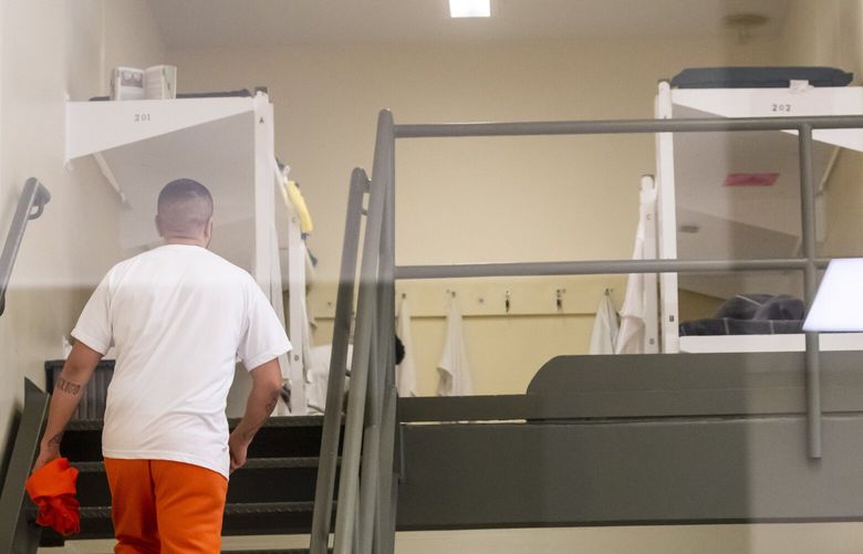A detainee walks up to his bunk in one of the pods of the regional detention center for immigrants in Tacoma, recently renamed the Northwest ICE Processing Center, Tuesday September 10, 2019. 211397