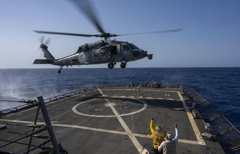 An HSC-7 helicopter lands on the Arleigh Burke-class guided missile destroyer USS Laboon in the Red Sea, Wednesday on June 12, 2024. The U.S.-led campaign against Iran-backed Houthi rebels has turned into the most intense running sea battle the Navy has faced since World War II. That’s what its leaders and experts tell The Associated Press, whose journalists visited U.S. ships off Yemen in recent days. (AP Photo/Bernat Armangue)