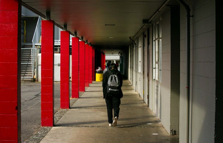 A student walks the campus at Totem Middle School on Tuesday, Oct. 19, 2021. The cafeteria and gym at Totem Middle School in Marysville is one of the state’s highest priorities for a seismic upgrade.