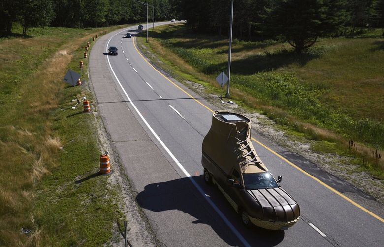 L.L. Bean Bootmobile on a highway in Portland, Maine on July 12, 2024. Midsummer to late fall is high season for the Bootmobile, a promotional vehicle that L.L. Bean dispatches to beaches, college campuses and town squares for brand activations and events. (T.J. Kirkpatrick / The New York Times) 
