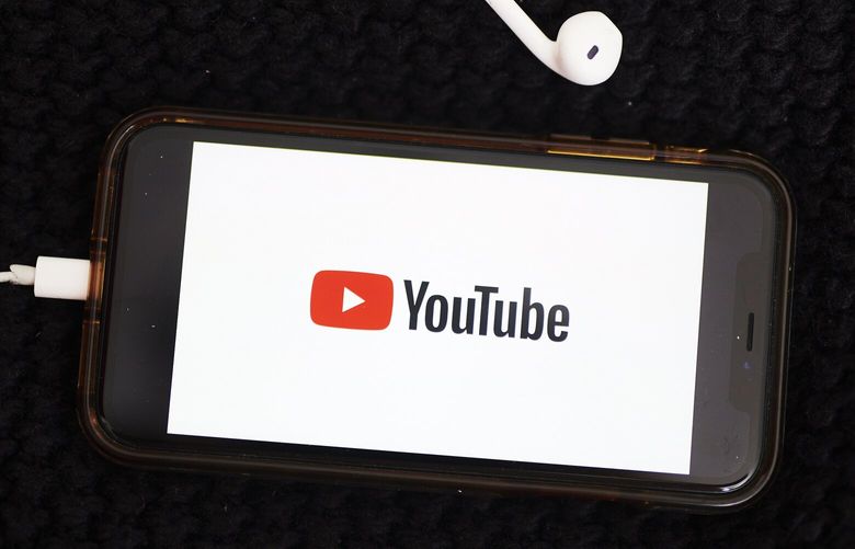 The logo for YouTube Inc. is displayed on a smartphone in an arranged photograph taken in the Brooklyn borough of New York, U.S., on Sunday, May 10, 2020.  Photographer: Gabby Jones/Bloomberg
