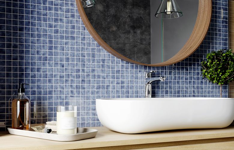 Try adding blue metallic tiles in a powder room. (Getty Images)