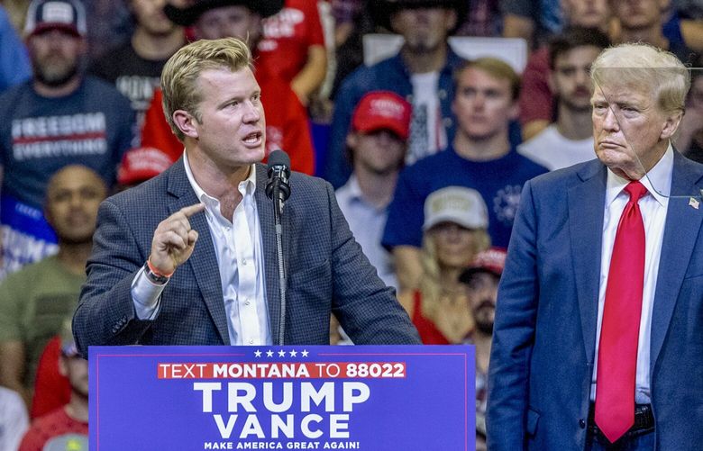 FILE — President Donald Trump watches as Tim Sheehy, the Republican nominee for Senate in Montana, speaks at a rally in Bozeman, Aug. 9, 2024. Sheehy made comments perpetuating racist stereotypes about Native Americans during private fund-raisers last year, according to recordings of the events published by a local news outlet late last week and obtained by The New York Times. (Louise Johns/The New York Times) XNYT0491 XNYT0491
