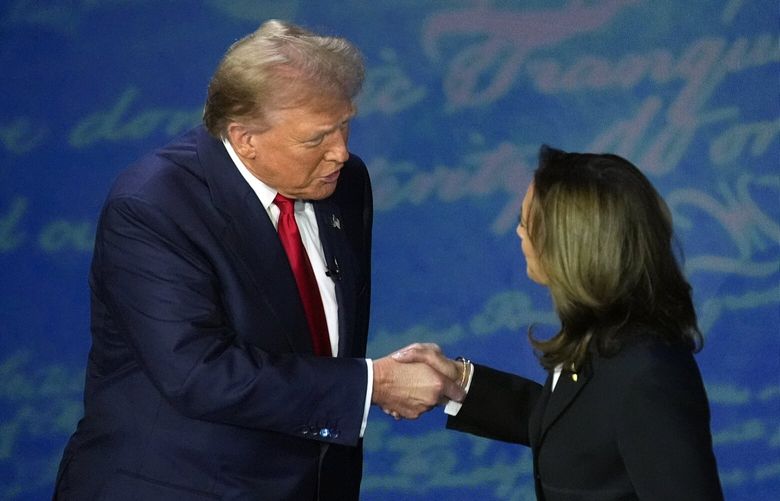 Republican presidential nominee former President Donald Trump shakes hands with Democratic presidential nominee Vice President Kamala Harris during an ABC News presidential debate at the National Constitution Center, Tuesday, Sept.10, 2024, in Philadelphia. (AP Photo/Alex Brandon) PAAB418 PAAB418