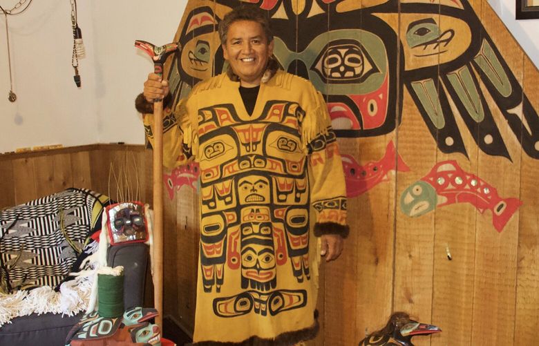 Kaaxooutch, who also goes by Garfield George, with the beaver prow in Angoon, Alaska, in 2018. MUST CREDIT: Courtesy of Garfield George