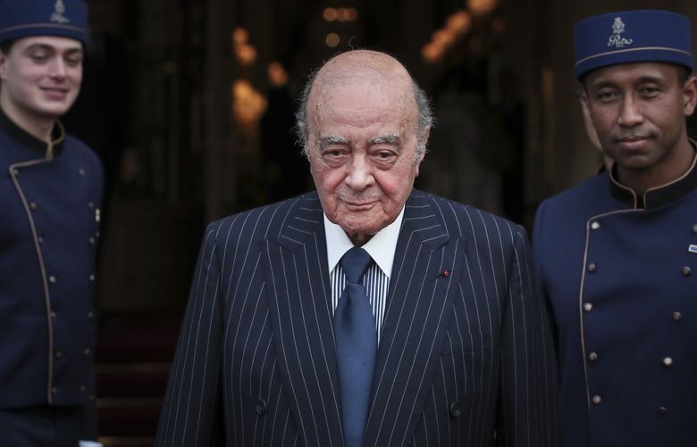 FILE – Egyptian businessman and Ritz hotel owner Mohamed Al Fayed poses with his hotel staff in Paris, June 27, 2016. Al Fayed, the former Harrods owner whose son Dodi was killed in a car crash with Princess Diana, has died at age 94. His death was announced Friday, Sept. 1, 2023, by Fulham Football Club, which Al Fayed once owned. (AP Photo/Kamil Zihnioglu, File)