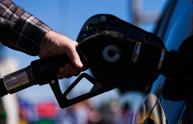James Lowe fills up his vehicle at Let’s Go Washington’s Gas Price Rollback in Federal Way Thursday, Aug. 29, 2024. The event offered gas at a lower price closer to the national average and focused on sharing information about Initiative 2117, which would repeal the state’s Climate Commitment Act. 227888