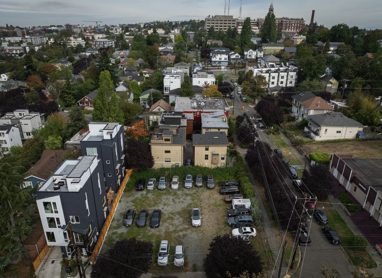 Goodwill Missionary Baptist Church plans to use its overflow parking lot, seen here, for affordable housing. (Ken Lambert / The Seattle Times)