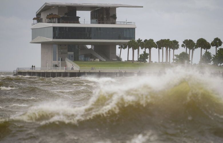 The St. Pete Pier is pictured among high winds and waves as Hurricane Helene makes its way toward the Florida panhandle, passing west of Tampa Bay, Thursday, Sept. 26, 2024 in St. Petersburg, Fla. (Martha Asencio-Rhine/Tampa Bay Times via AP) FLPET302 FLPET302