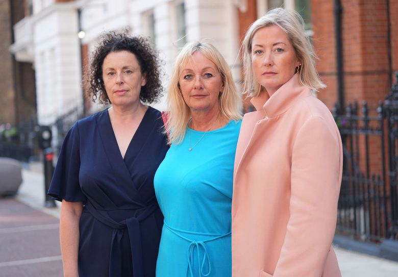 Three of Mr Al Fayed&#8217;s accusers, left to right, Katherine (no surname given), Lindsay Mason and Gemma (no surname given), pose for a photograph after a press conference about the investigation and the legal claim against Harrods for failing to provide a safe system of work for their employees, at Kent House in Knightsbridge, London, Friday Sept. 20, 2024. (Yui Mok/PA via AP)