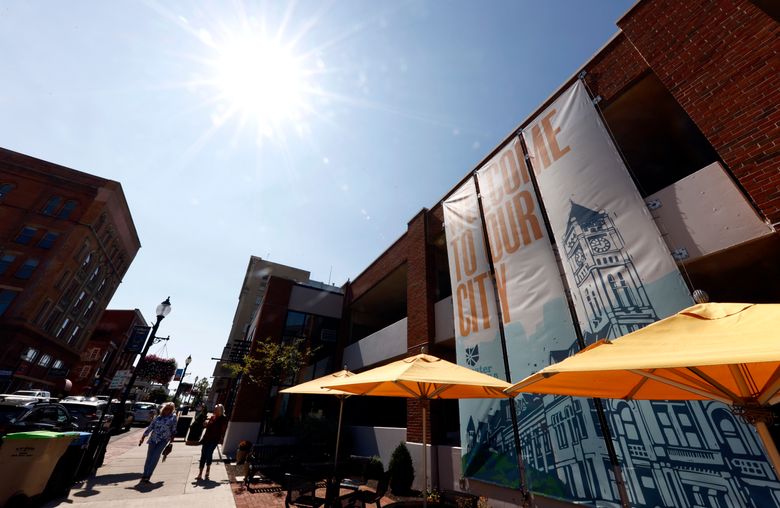 Pedestrians walk down Fountain Avenue in Springfield, Ohio, Wednesday, Sept. 11, 2024. (AP Photo/Paul Vernon)