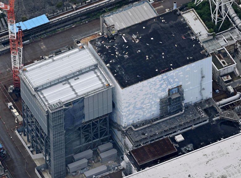 A robot begins removal of melted fuel from the Fukushima nuclear plant. It  could take a century | The Seattle Times